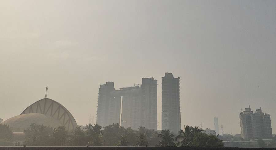 The faintly visible half-dome of Science City and highrises in the EM Bypass area enveloped by light fog on Monday morning