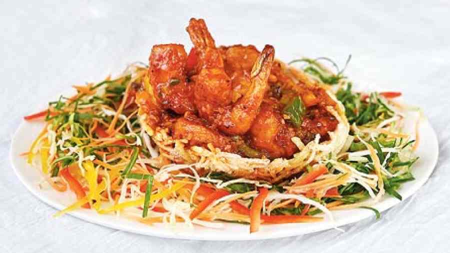 Prawn Birdnest: Fresh prawns cooked to perfection with onion, garlic and chilli and tossed in tomato-based gravy. Rs 450