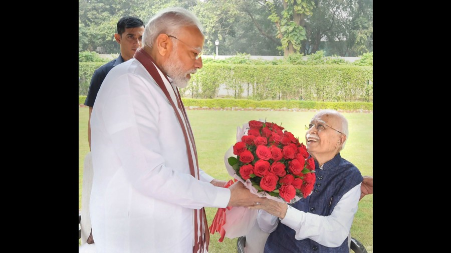 Prime Minister Narendra Modi meets veteran BJP leader Lal Krishna Advani on the latter's birthday, in New Delhi, Tuesday, November 8, 2022