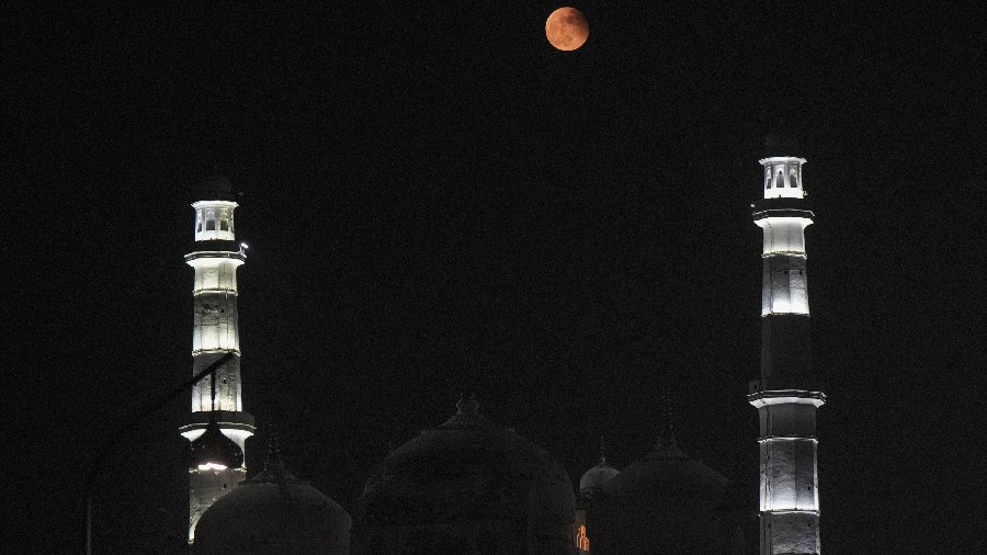 Full Moon seen in the sky above the old city of Lucknow