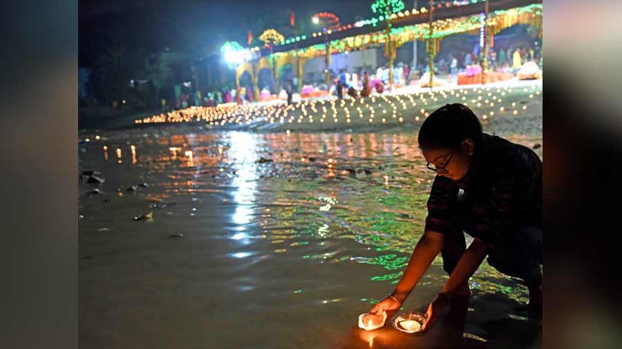 Hundreds of people offered diyas to the waters of the Hooghly to mark the occassion