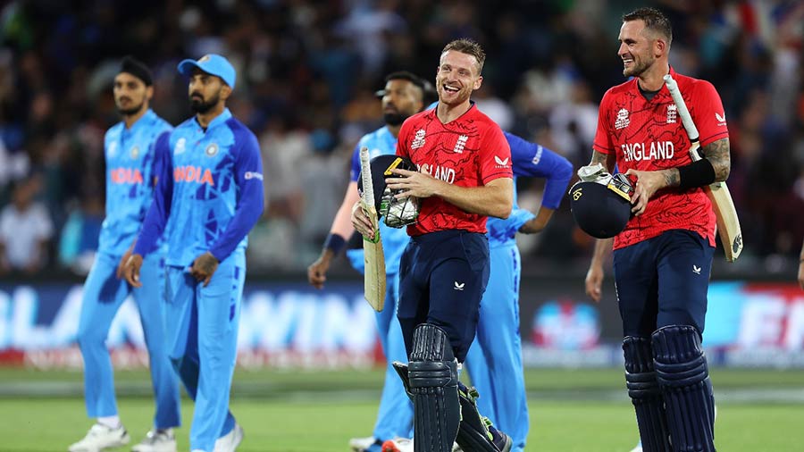 Jos Buttler and Alex Hales of England share a laugh as they celebrate their 10-wicket victory over India