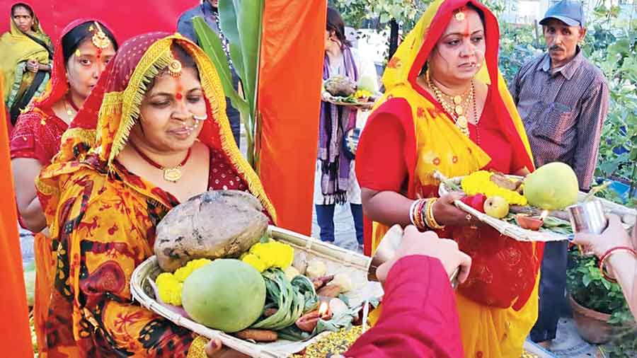 Women offer Chhath prayers on the HB Block terrace 