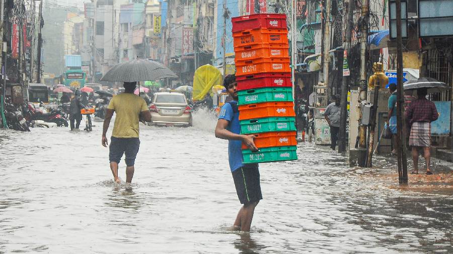 Commuters struggle to carry on with their daily chores due to rain