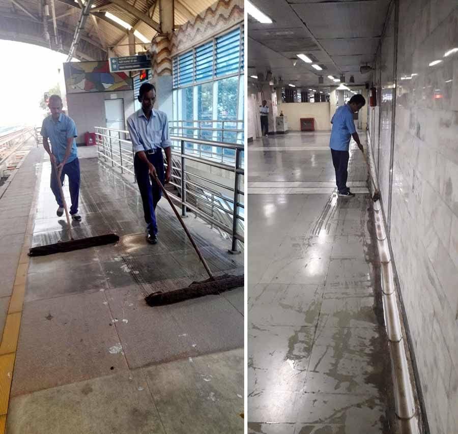 Workers mop the floors of Kolkata Metro platforms as part of an intensive cleanliness drive organised at different Metro stations in the north-south and east-west corridors