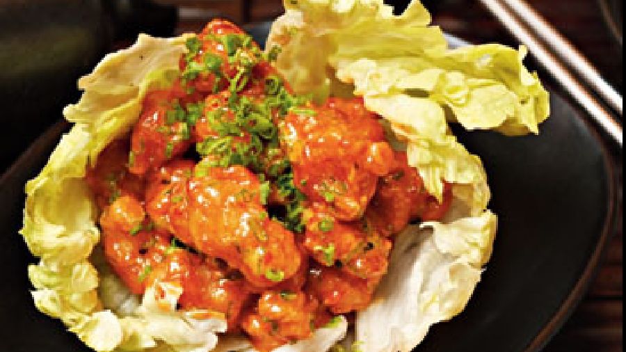 The Pop Corn Shrimp is a close cousin of dynamite prawns. Black tiger prawns are fried to perfection and then laced with a spicy chilli mayonnaise.