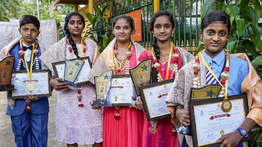 Bravery award recipients pose for a photo during the celebration of Children's Day, at Cubbon Park in Bangalore. The bravery awards are given to children who show courage and presence of mind to save the life of others in a dangerous situation.