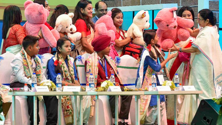 West Bengal Chief Minister Mamata Banerjee with school students during a programme under the state government's 'Taruner Swapna Scheme', in Kolkata. 