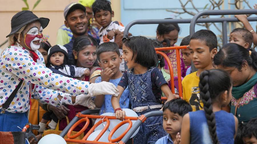 Children ride a swing during Children's Day celebrations organised at Bai Jerbai Wadia Hospital for Children, in Mumbai.