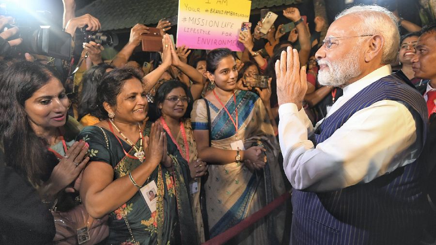 Prime Minister Narendra Modi being greeted by Indian community after arriving in Bali to attend the G20 Summit, on Monday, November 14, 2022