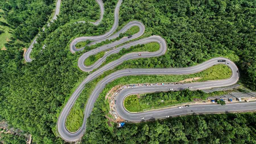 A road snakes through Patratu Valley, a major tourist attraction in the state