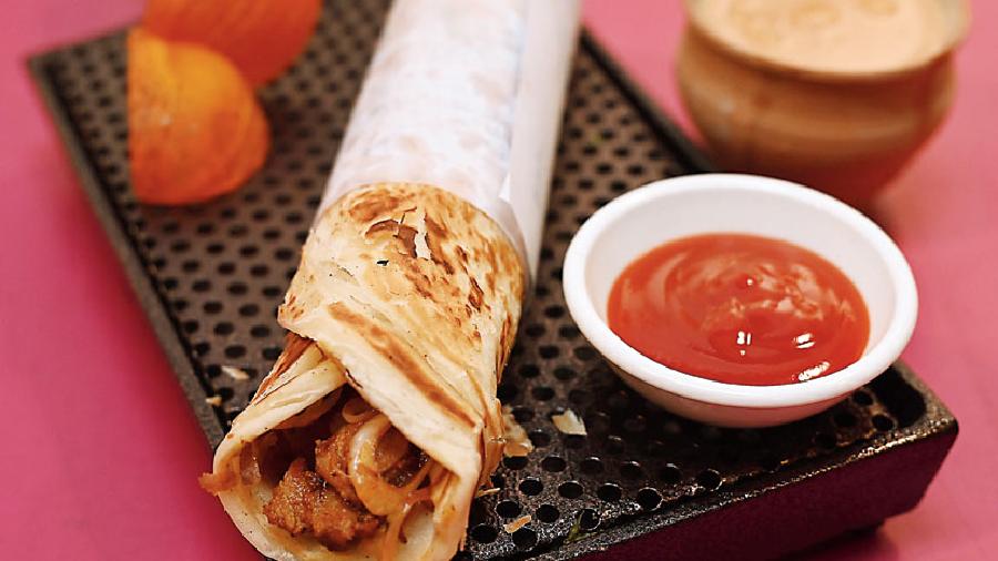 Chicken Tikka Kathi Roll with Masala Delight: A perfect juicy tender roll for your takeaways and quick meals.