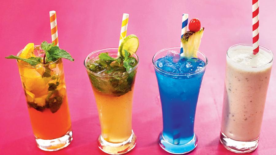 This is one refreshing series of sips — (l-r) Orange Mojito (made with orange juice, mint and soda), Soda Shikhanji (made with lemon juice, sugar syrup, mint soda and ice), Deep Blue Sea and Masala Chaas (available in the plain variety too).