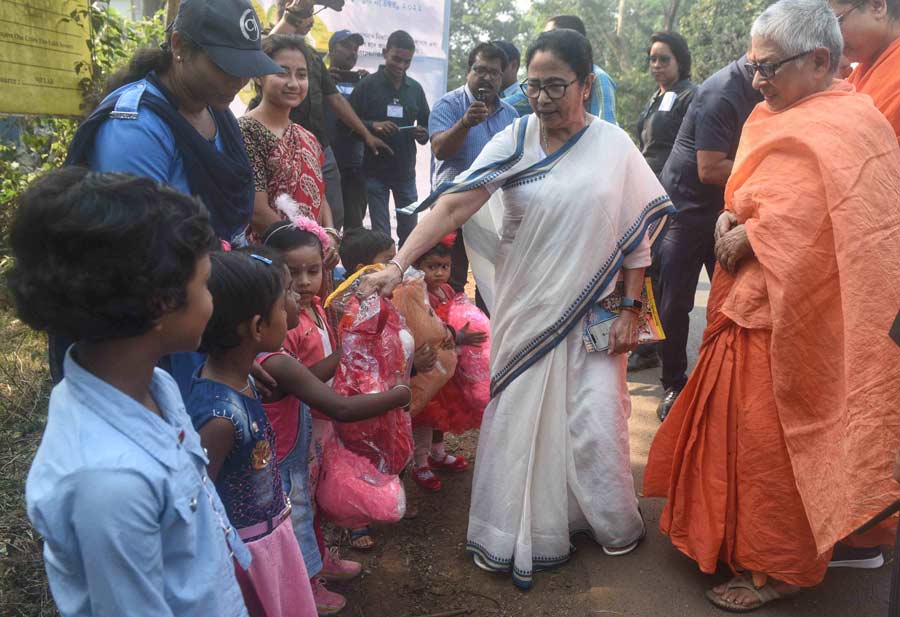 West Bengal chief minister Mamata Banerjee presents soft toys to children during her visit to Jhargram on November 16 