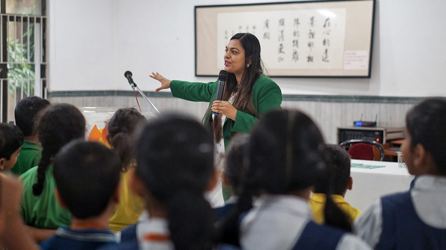 Author Pragati Jalan Sureka talks with students of Class III