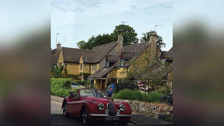 Local villagers taking out their vintage car on a sunny summer morning