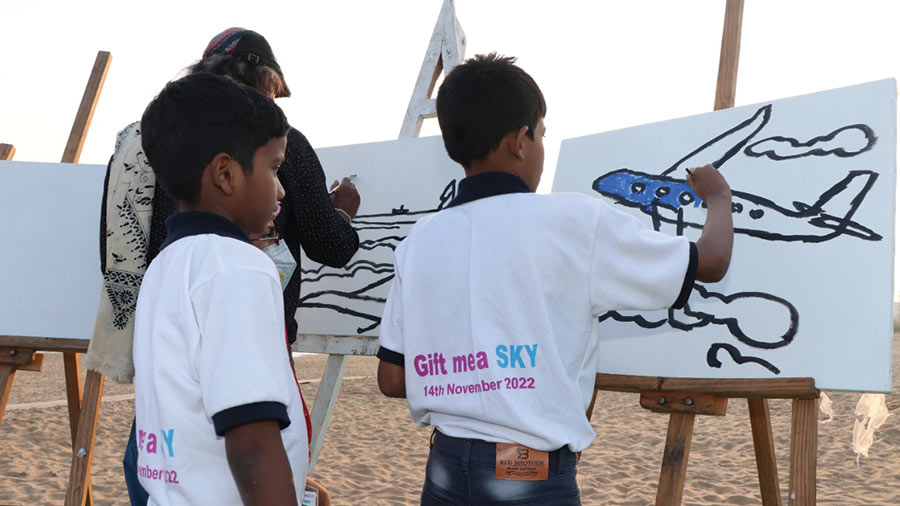 Children enjoy art time with Samir Aich 