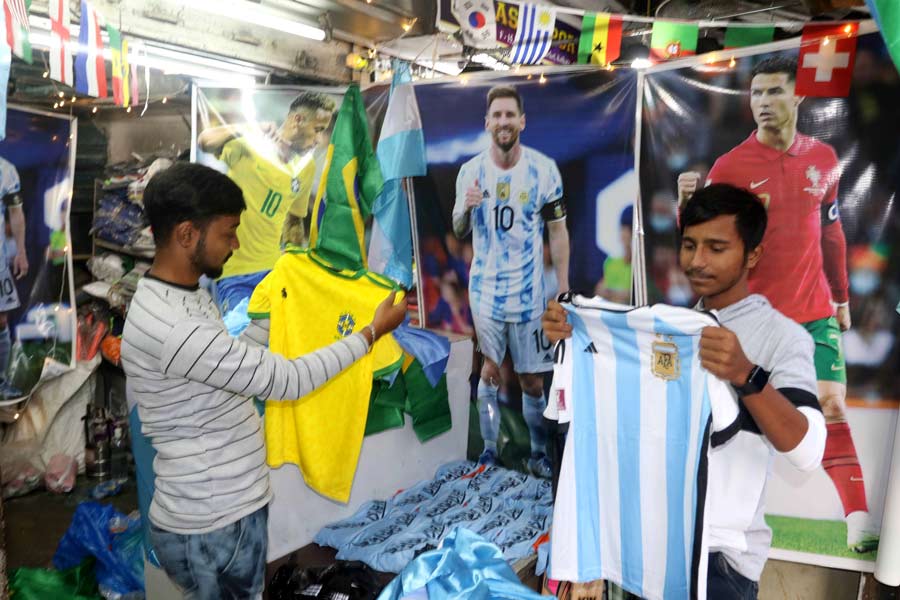 With only a few days left before World Cup 2022 begins, fans check out football jerseys at Maidan market on Thursday