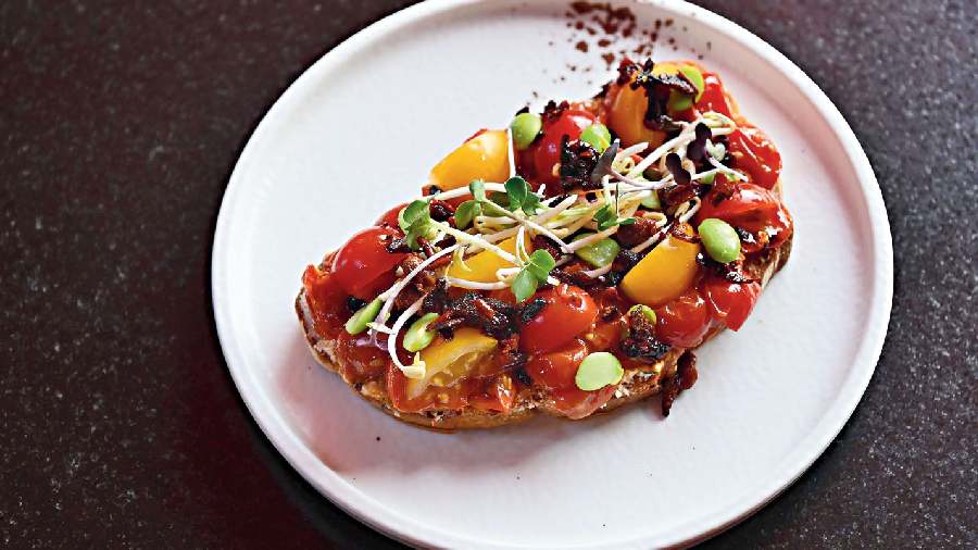 Ricotta Chilli Toast: A balance of sweet and tangy flavours on a bed of freshly baked in-house sourdough bread is what makes this a fave. Cherry tomatoes add the perfect amount of sweetness, the ricotta adds a creamy bite whereas the pickled daikon and chilli crisps further add to the taste.