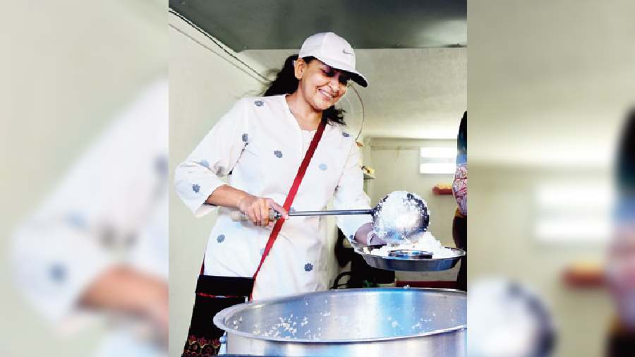 Radhika serves people regularly at meal times