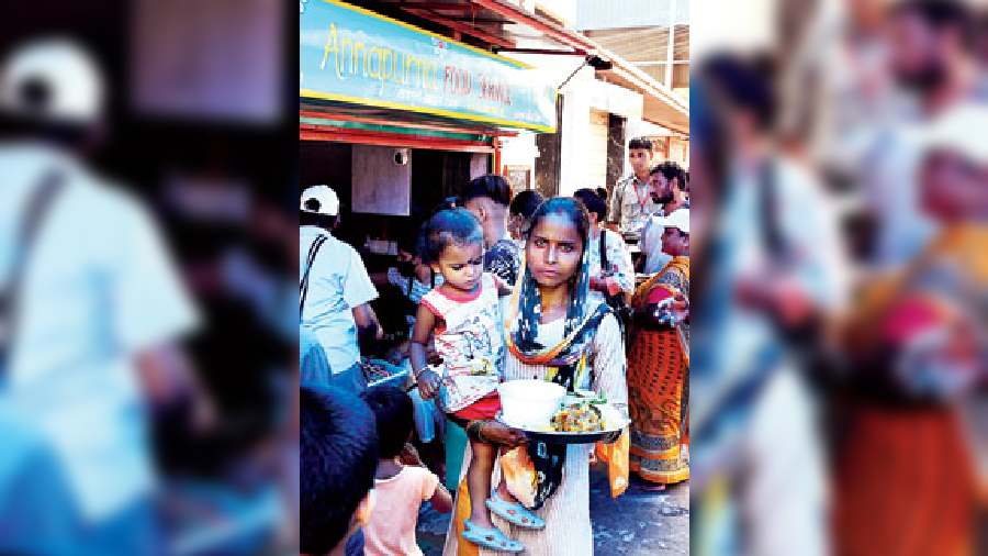 A woman with her child with freshly served food