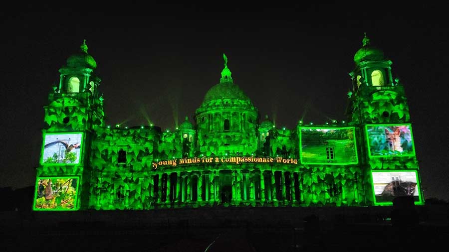 Photographs projected on the façade of the Victoria Memorial