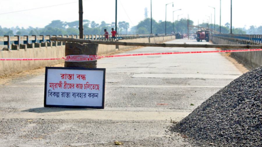 The Sundarpur bridge in Murshidabad’s Burwan being repaired on Saturday