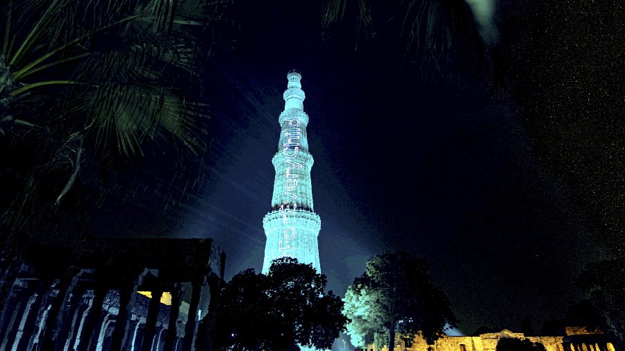 Qutub Minar illuminated in blue colour on the eve of World Children's Day, in New Delhi. 