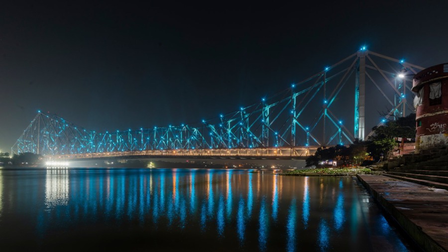 Howrah Bridge in West Bengal lit up blue on the eve of World Children's Day. 