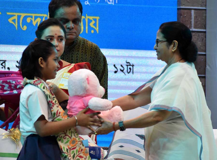 Chief minister Mamata Banerjee gifts a teddy bear to a girl on Children’s Day, November 14, Monday. The event was organised at Netaji Indoor Stadium