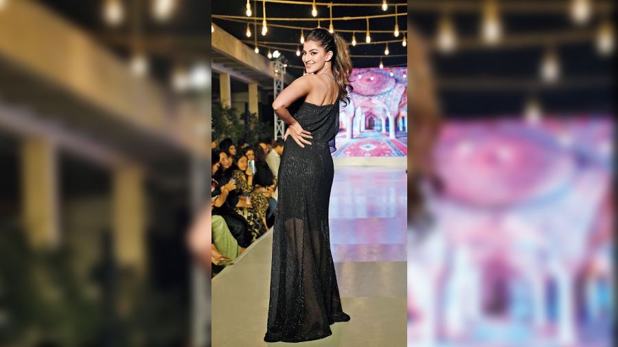 Sanjana Banerjee looked party-ready on the ramp in a single shoulder black sequinned outfit. It was interestingly detailed with crystal studded silver safety pin