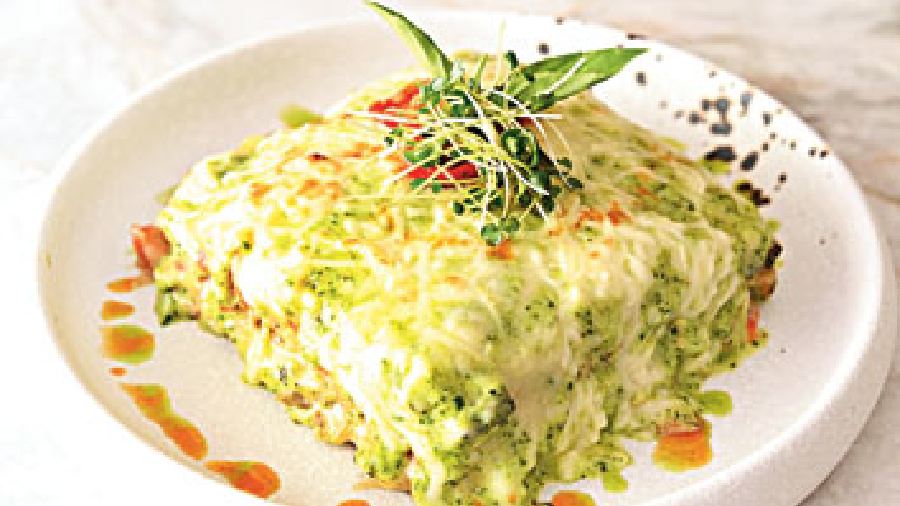 Lasagna Genovese: The Lasagna gets a pesto twist where the usual tomato paste layering is replaced by herby basil pesto and then baked to perfection