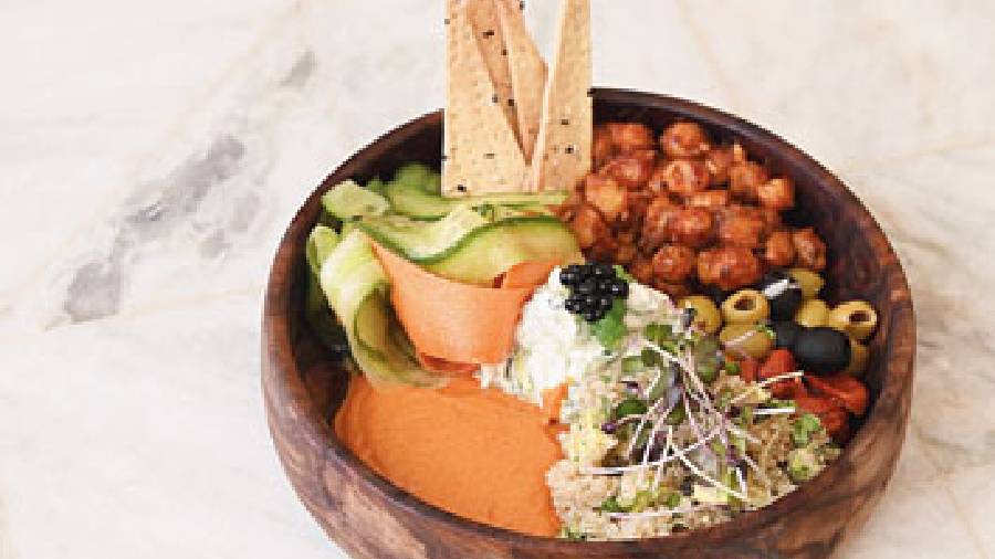 Mediterranean Buddha Bowl and Quinoa: Tzatziki, muhammara, and chickpeas tossed with BBQ sauce, lavash and quinoa salad is a game-changer when it comes to Mediterranean flavours