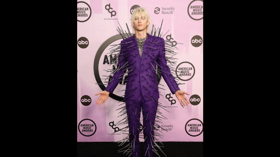 Machine Gun Kelly's purple suit with silver spikes scramed 'BOLD'. He won the Favourite Rock Artist at the AMAs. 