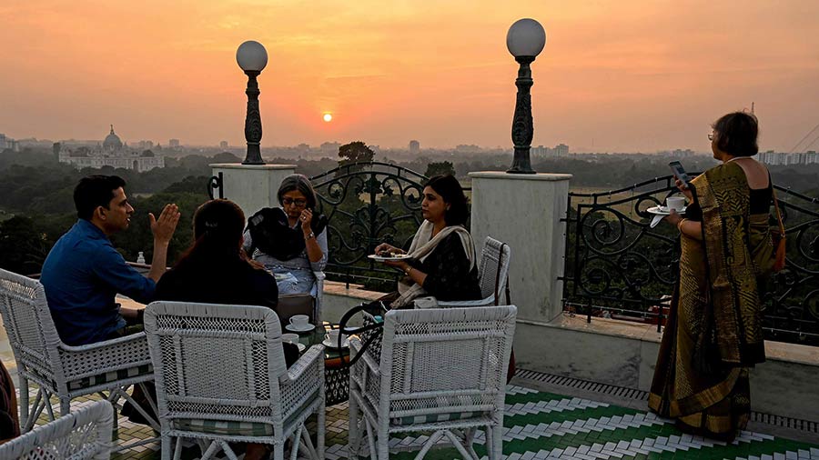 Guests enjoy the signature Glenburn high tea against the backdrop of a gorgeous Kolkata sunset, seen from the rooftop of the Glenburn Penthouse  