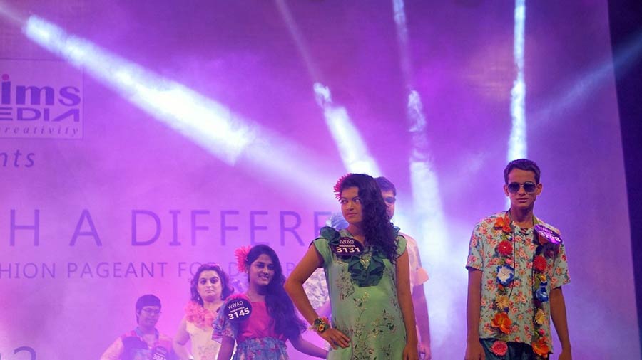 Participants walk the ramp wearing clothes specially designed to meet the needs of  differently abled persons