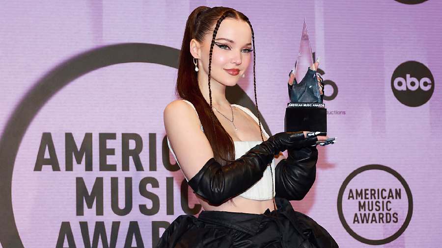 Dove Cameron paid tribute to the queer community in the aftermath of Colorado Springs shooting at a LGBTQ nightclub when she went on stage to accept the New Artist of the Year. She also performed Boyfriend at the awards show in a sultry, wildly sexy remix of her hit song.