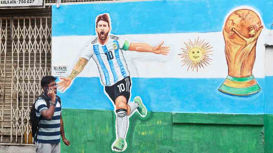 WORLD CUP FEVER: A graffiti along Gopal Nagar Road depicts Argentine football star Lionel Messi in action