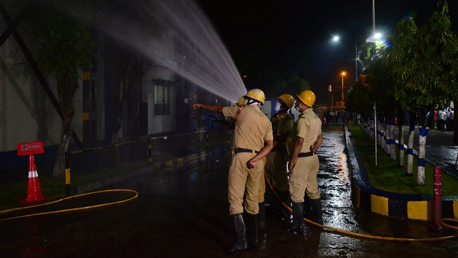 Firefighters attempt to control the gas leakage at the site on Monday evening