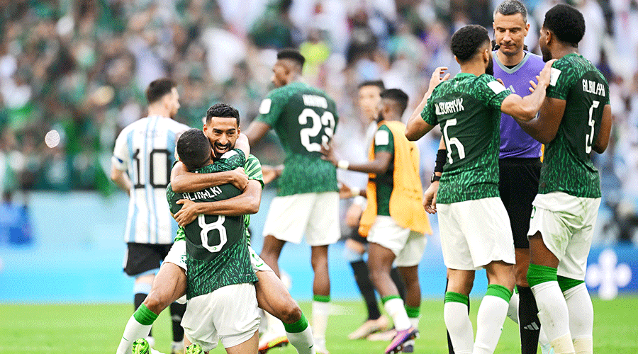 Saudi Arabia players celebrate after their 2-1 upset over Argentina in their World Cup Group C at Lusail Stadium on Tuesday.