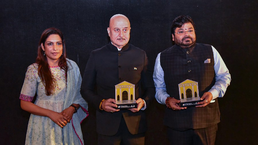 Bollywood actor Anupam Kher and Zee Studios Chief Business Officer Shariq Patel being felicitated during the red carpet at 53rd International Film Festival of India. 
