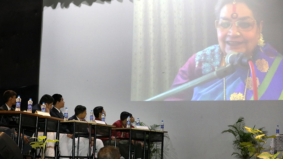 Children listen to Usha Uthup, the guest quiz master