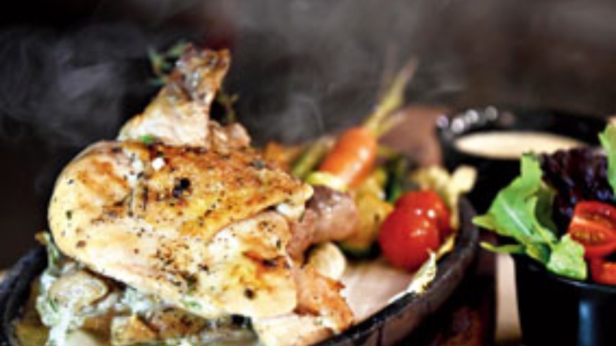 Farm Fed Chicken Sizzling Grill: A traditional sizzler dish that has the main as farm-fed chicken leg and breast along with rustic purple potatoes, snow peas, baby carrots, and Brussel sprouts. You can choose a sauce from options such as dill lemon butter, pommery cream and chimichurri.
