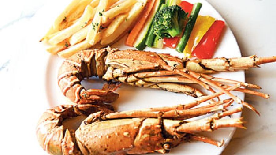 Kingpin: Seafood lovers will love these huge lobsters marinated with Dijon mustard, lime juice, and chopped garlic that lends sharp flavours to the lobsters when grilled. Eating this could be a bit messy but who cares?