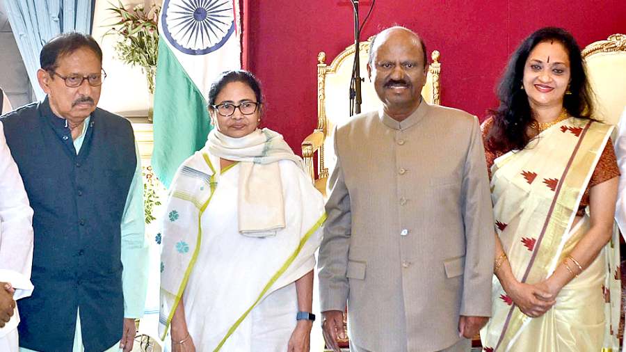 Mamata Banerjee with new governor CV Ananda Bose and his wife at Raj Bhavan on Wednesday.