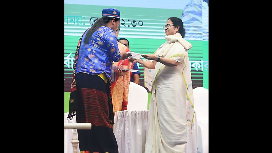 Mamata Banerjee at a programme in Calcutta on Wednesday to distribute pattas to nearly 4,000 landless people in Bengal