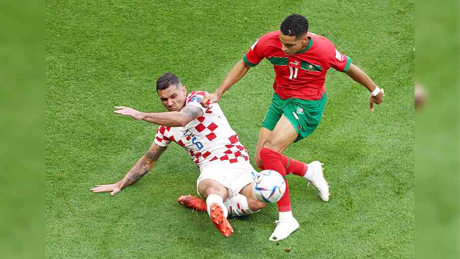 Croatia’s Dejan Lovren (left) vies for the ball with Morocco’s Abdelhamid Sabiri in Al Khor on Wednesday.