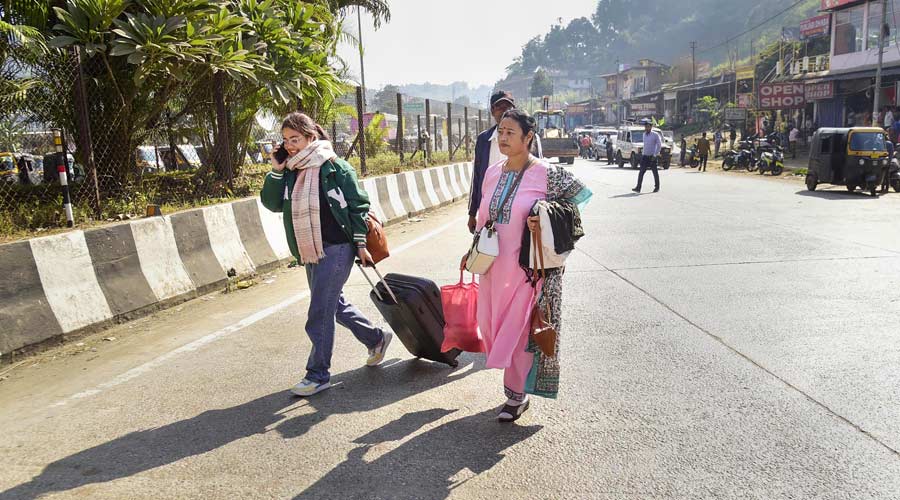 Assamese people return from Shillong, a day after violence at a disputed Assam-Meghalaya border location that killed six people, in Jorabat, Wednesday, Nov. 23, 2022. Assam residents used vehicles registered in Meghalaya to reach the state border following reports of attacks on vehicles from Assam in Meghalaya.