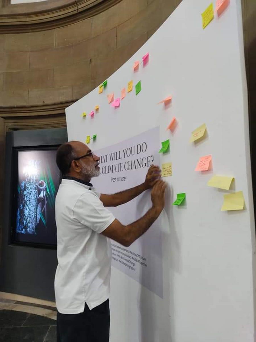 Former Union minister of state for culture and tourism, K.J.Alphons, shares his views regarding climate change on the Wall of Sticky Notes at Victoria Memorial Hall. The installation has been put up as part of an exhibition titled Young Minds For A Compassionate World 