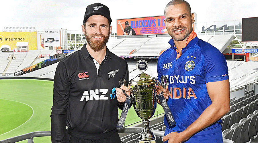 India captain Shikhar Dhawan (right) and New Zealand skipper Kane Williamson with the ODI series trophy at Eden Park, Auckland, on Thursday.
